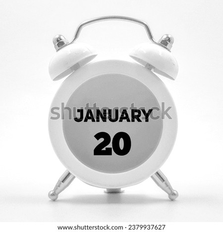 Twentieth January written over clock  Royalty-Free Stock Photo #2379937627