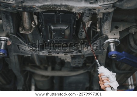 Automatic transmission flushing and fluid change service ,automatic transmission complete fluid exchange service. Royalty-Free Stock Photo #2379997301