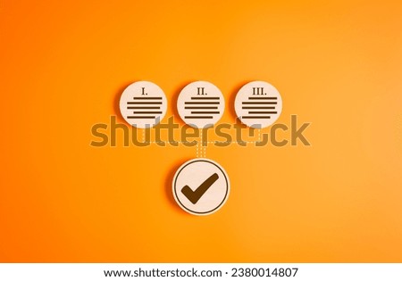 Wooden circle label with a tick check mark for accept Terms of use concept on orange background. Agree to the contract terms and conditions of website or application then go to Next Step progress. Royalty-Free Stock Photo #2380014807