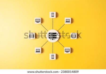 Client server connection or data center concept. Cloud computer technology. Wooden cubes with server and laptop, computer, smartphone, and tablet icons linked with each other with connected line