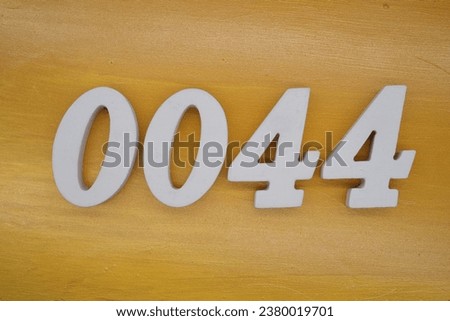 The golden yellow painted wood panel for the background, number 0044, is made from white painted wood.