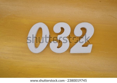 The golden yellow painted wood panel for the background, number 032, is made from white painted wood.