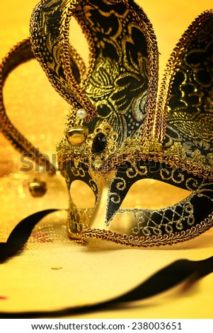 Vintage carnival mask in glittering background