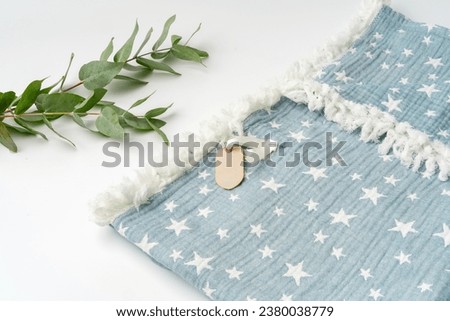 Muslin blanket with star pattern on white background