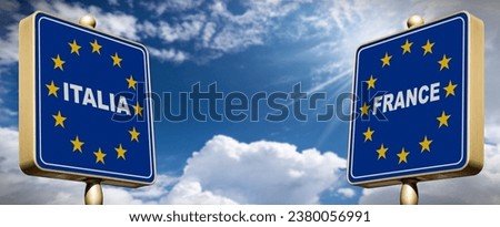 Italian-French Border concept. Two road signs with text Italia (Italy) and France with the European Union flag, against a blue sky with clouds and copy space. Schengen agreement.