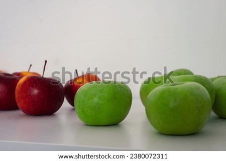 Two groups of green and red apples. Organic fresh fruits and image of fall apple harvest 