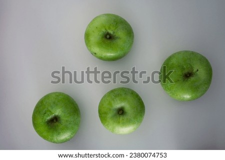Group of green apples frome the top. Organic fresh fruits and image of autumn harvest background