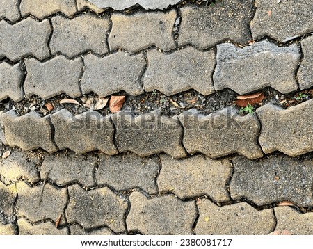 a cobblestone street with a crack in it.