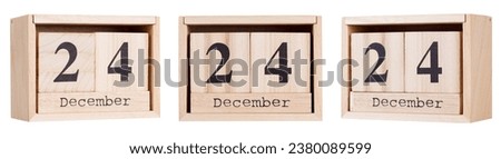 Wooden calendar, a set of dates of the month 24 December, on a white and transparent background close-up Royalty-Free Stock Photo #2380089599