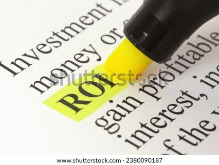 "ROI" highlighted with a felt tip pen Royalty-Free Stock Photo #2380090187