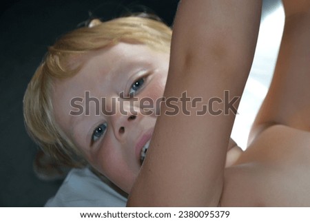 Just awaked boy. Portrait of a cute handsome child awakened. Happy smiling boy toddler infant laid. Little boy travels by train. High quality photo