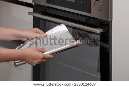 Baking aluminum foil used in the kitchen Royalty-Free Stock Photo #2380124609