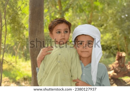 Portrait of two Pakistani baby boys posing beautifully.Asian boys posing.Pakistani kids.Pakistan's Youth.Happy childrens photography.Beautiful childhood.Tension Free life concept.with selective focus.