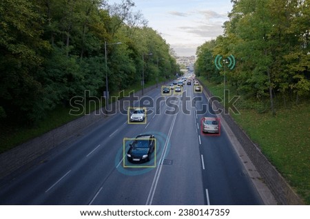 AI smart city traffic cameras monitoring concept. Street with cars. Counting cars, recording license plates, measuring speed, Wi-Fi Royalty-Free Stock Photo #2380147359