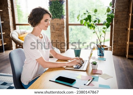 Photo of young confident business lady copywriter using laptop employer wooden desk workstation job tools isolated office house background
