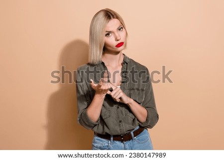 Photo of unhappy unsatisfied lady wear khaki shirt looking you counting fingers isolated beige color background Royalty-Free Stock Photo #2380147989
