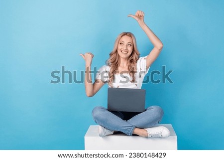 Full length photo of funky dreamy lady wear white blouse working modern device two thumbs empty space isolated blue color background