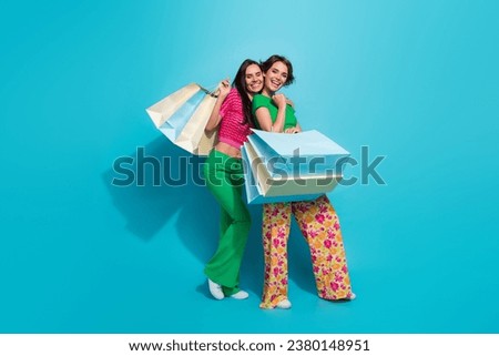 Perfect friendship two girls support each other shopping makes you happy advert photo picture elegance isolated on blue color background Royalty-Free Stock Photo #2380148951