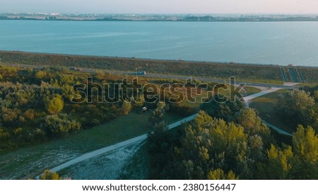 Aerial view over Danube river near Bratislava, Slovakia. The Photography was shoot from a drone at a higher altitude above the river in the morning at sunrise.