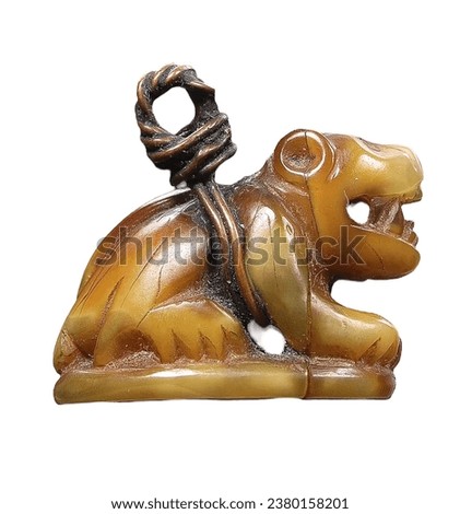 Picture of a tiger sitting with its mouth open An amulet made from a Crouching Tiger's fang tied with wire for portability. white wallpaper