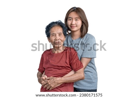 Happy grandmother and granddaughter showing love. Looking at the camera. Granddaughter embracing grandma. Show concern for the relationship in a happy family Picture of love in the family.