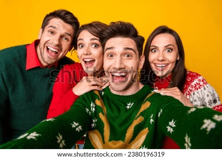 Photo of crazy positive buddies making selfie celebrate christmas x mas isolated over vivid color background Royalty-Free Stock Photo #2380196319