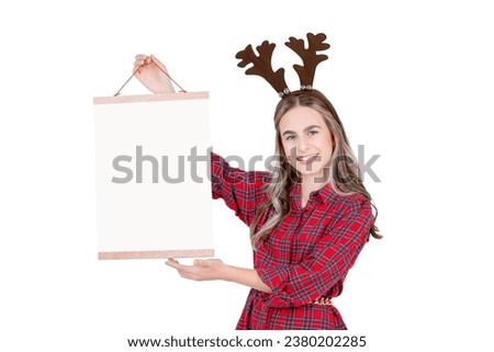 Cute cheerful teenage girl holding blank white paper poster close-up isolated on white background. Place for text.