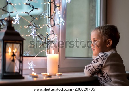 Child at Christmas eve and New Year