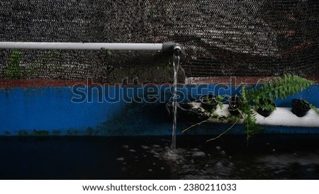waterfall on the pipe with black watet