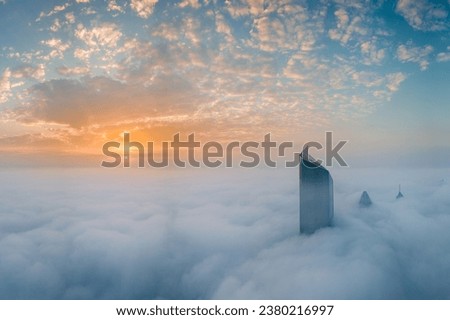 Picture in Kuwait city for the tallest tower called al Hamra tower above the fog