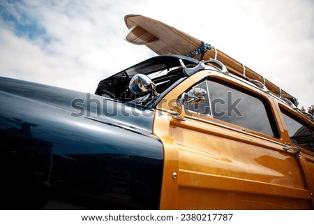 Classic Car Woody Surf Wagon Royalty-Free Stock Photo #2380217787