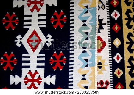 Carpets displayed for sale in a bazaar , patterns, texture. Royalty-Free Stock Photo #2380239589