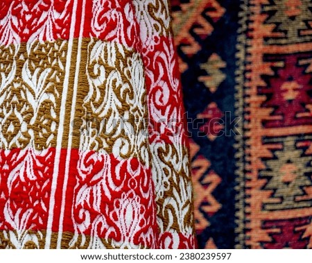 Carpets displayed for sale in a bazaar , patterns, texture. Royalty-Free Stock Photo #2380239597
