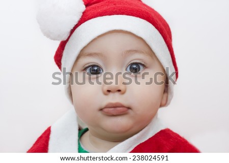 baby with one year old santa claus dress