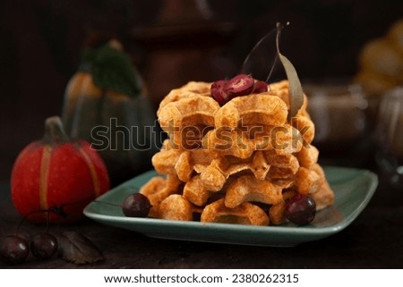 Homemade Pumpkin waffles. Autumn, Halloween, Thanksgiving Food Concept. Royalty-Free Stock Photo #2380262315