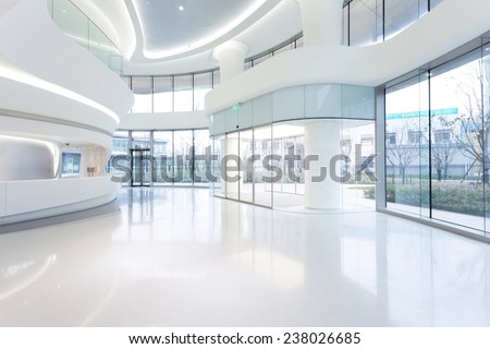 futuristic modern office building interior in urban city  Royalty-Free Stock Photo #238026685