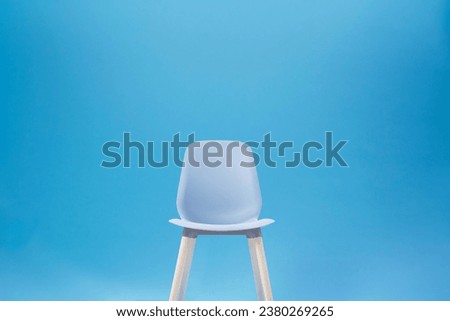 Blue classic chair on the blue backdrop for Chroma Key technique in the photo shooting studio for interview or filmmaking Royalty-Free Stock Photo #2380269265
