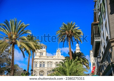 Historical, colorful buildings and palm trees in La Vegueta, a historical neighbourhood in Las Palmas de Gran Canaria, Canary Islands, Spain Royalty-Free Stock Photo #2380275311