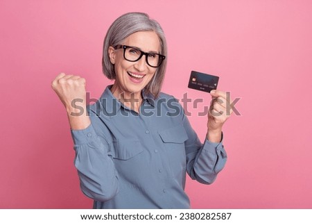 Photo of overjoyed glad successful lady wear stylish clothes rejoice salary transactions transfer isolated on pink color background