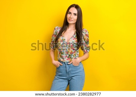 Photo of adorable confident girl dressed bright stylish summer outfit isolated on vivid yellow color background