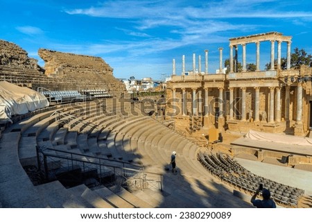 Tourists taking photos and marveling at the contemplation and vision of the Roman theater of Mérida from the stands