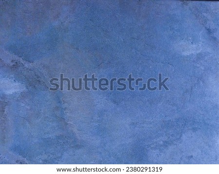 Blue blurred surface. Blue background with abstract pattern. Concrete floor.
