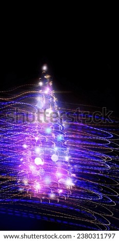 Silhouette of a Christmas tree made of lights on a dark background.