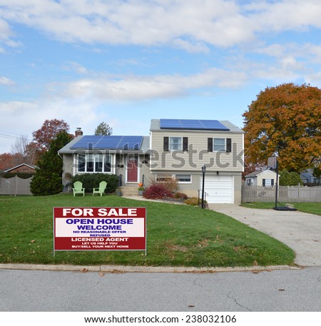 Real Estate for sale open house welcome sign Suburban high ranch house autumn day residential neighborhood blue sky clouds USA