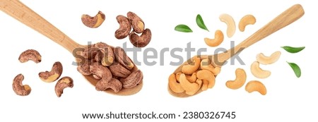cashew nuts heap with shell in wooden spoon isolated on white background. Top view. Flat lay Royalty-Free Stock Photo #2380326745