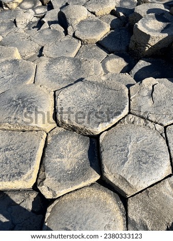 Inexplicable but beautiful Giant’s Causeway, Ireland. Octagonal rocks formed by nature.  Royalty-Free Stock Photo #2380333123