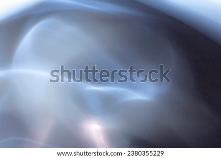 blurred electrical silver waves on dark blue, grey and violet background