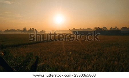 Early morning in mountains. village Beautiful sunrise above the clouds. Morning sky.
