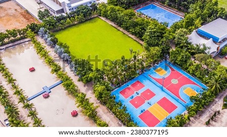 Aerial view of an empty stadium, football field, basketball court. and badminton court healthy lifestyle. Bangkok, Thailand Royalty-Free Stock Photo #2380377195