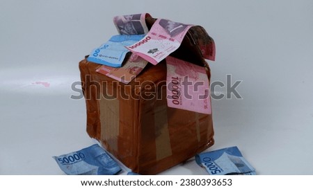 package shopping concept with lots of money bills near the package, shopping,saving,investment on white background